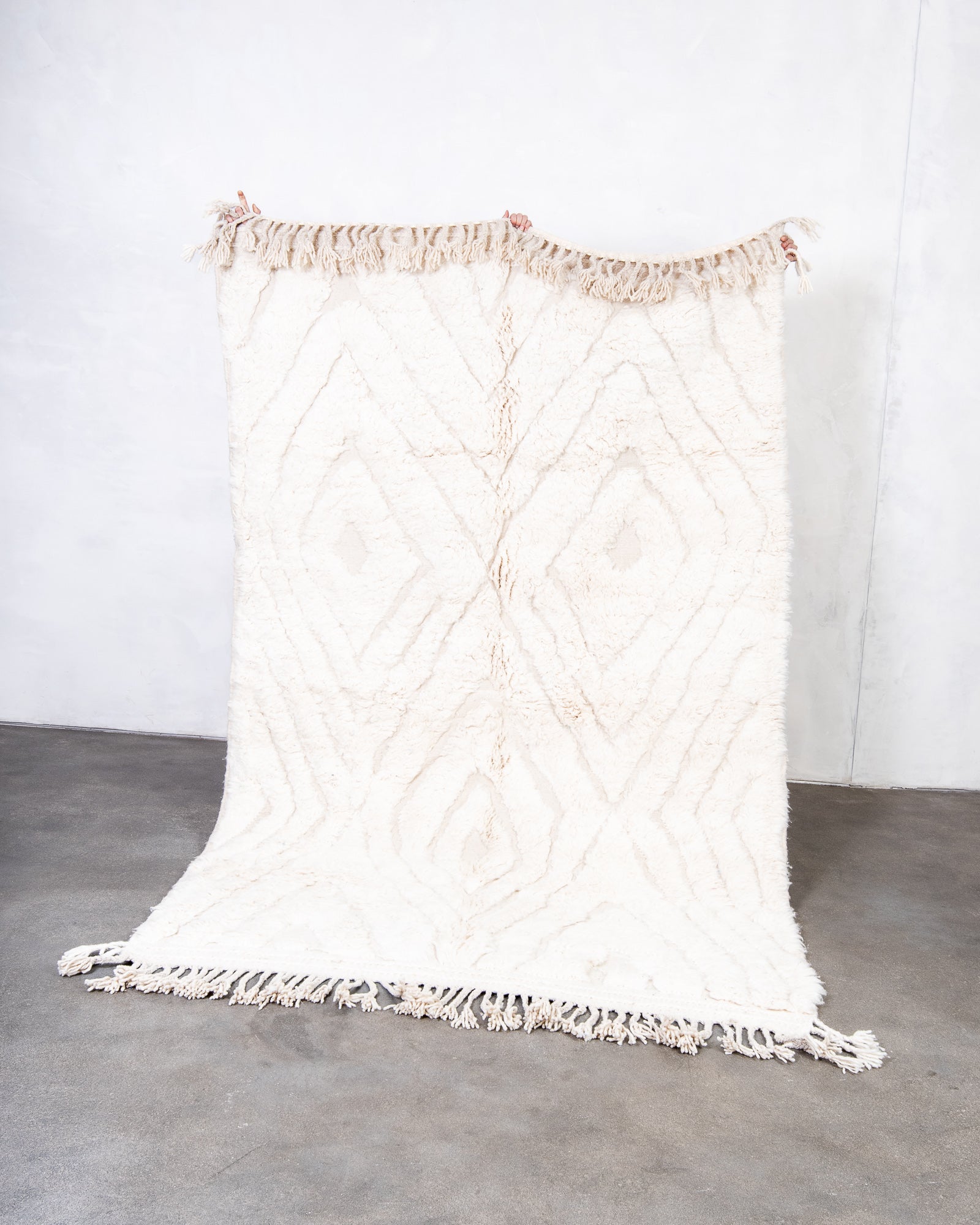 Modern, designer, handcrafted Berber rug from Morocco. Beniourain carpet with beautiful colours and patterns and fluffy wool texture.
